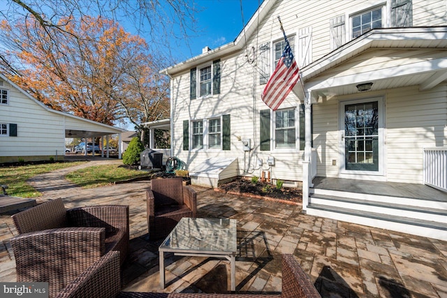 back of house with a patio