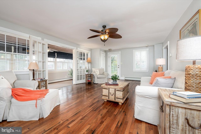 living room with dark wood-type flooring, a baseboard radiator, and ceiling fan