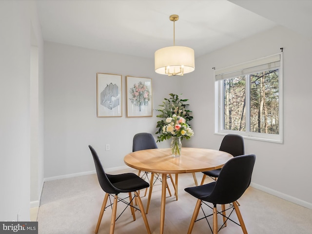 dining room featuring light colored carpet