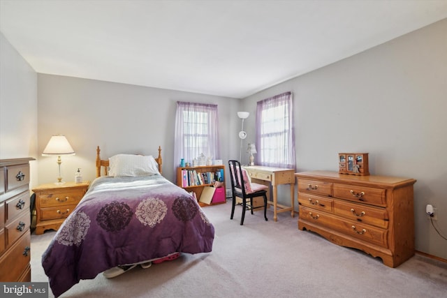 bedroom featuring light colored carpet