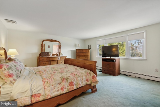 carpeted bedroom featuring a baseboard radiator