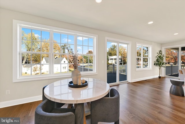 dining space with dark wood-type flooring