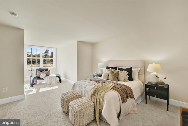 bedroom featuring light carpet