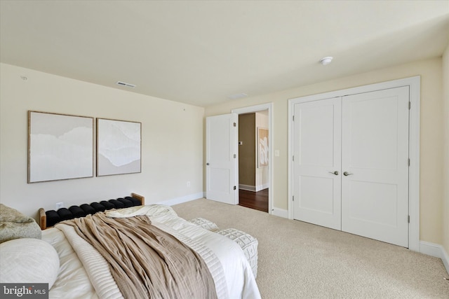 carpeted bedroom with a closet