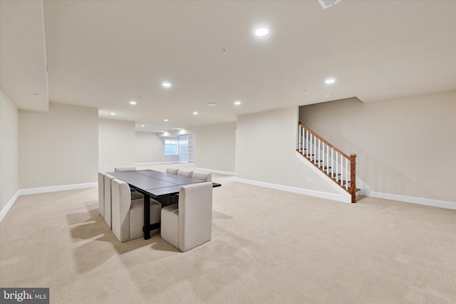 game room featuring light colored carpet