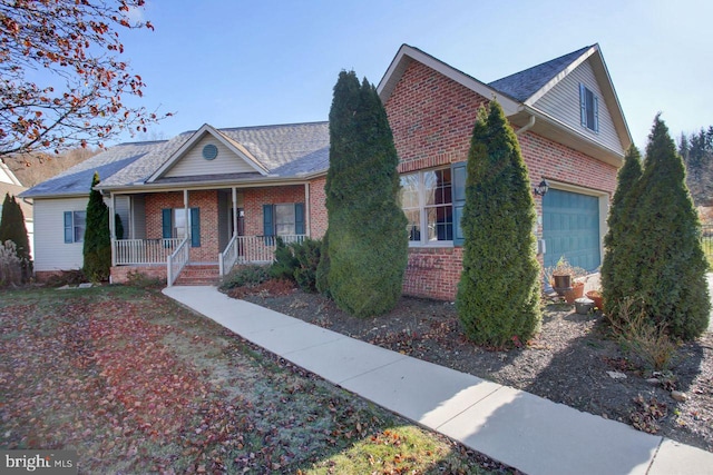 view of front of property with a porch and a garage