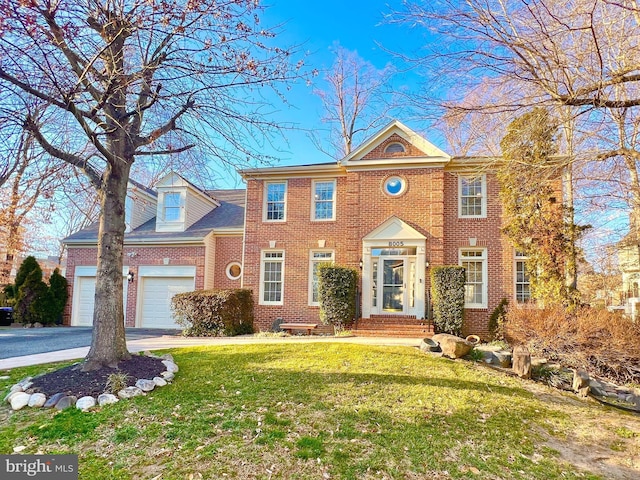 view of front of home with brick siding, an attached garage, driveway, and a front yard