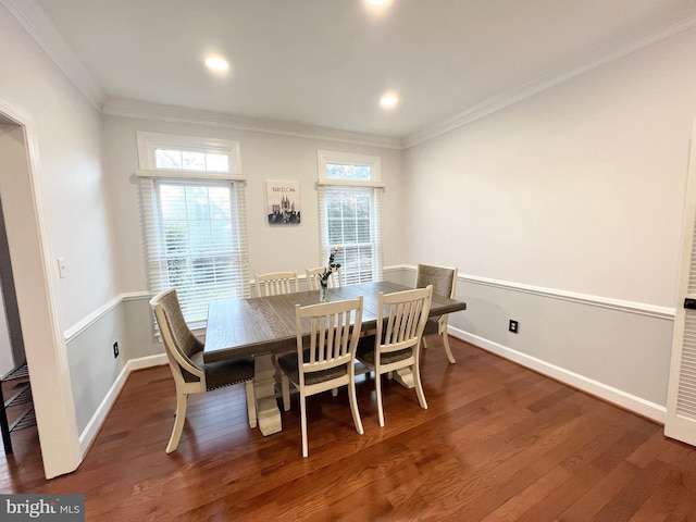 dining area featuring plenty of natural light, wood finished floors, and ornamental molding