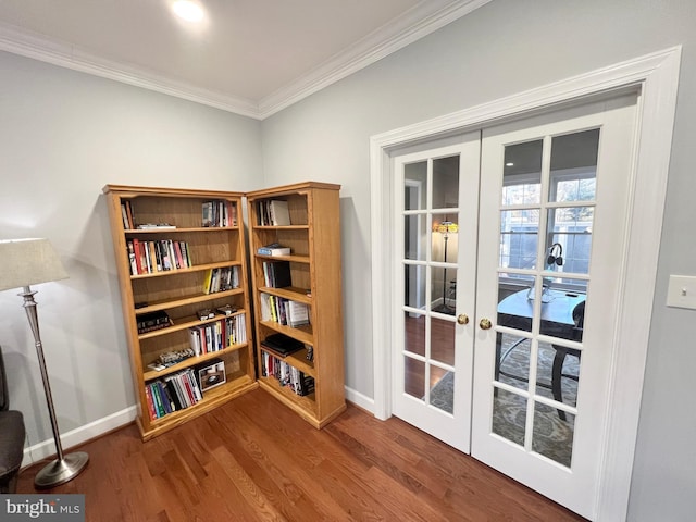 sitting room featuring wood finished floors, french doors, baseboards, and ornamental molding