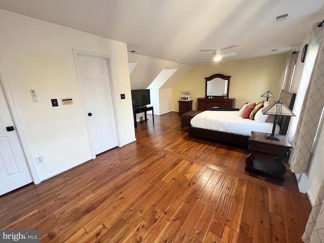 bedroom featuring visible vents, baseboards, ceiling fan, and wood-type flooring