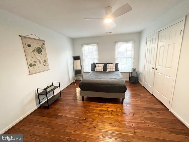 bedroom featuring visible vents, baseboards, and hardwood / wood-style flooring