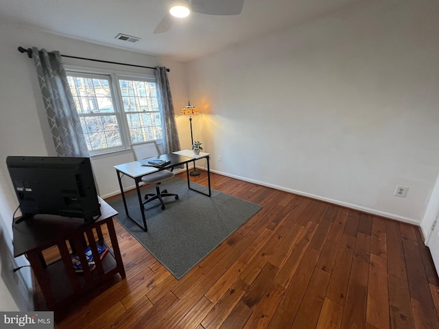 office area featuring baseboards, visible vents, wood-type flooring, and ceiling fan