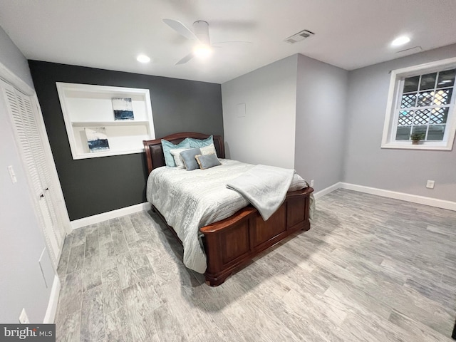 bedroom featuring visible vents, recessed lighting, light wood finished floors, baseboards, and ceiling fan