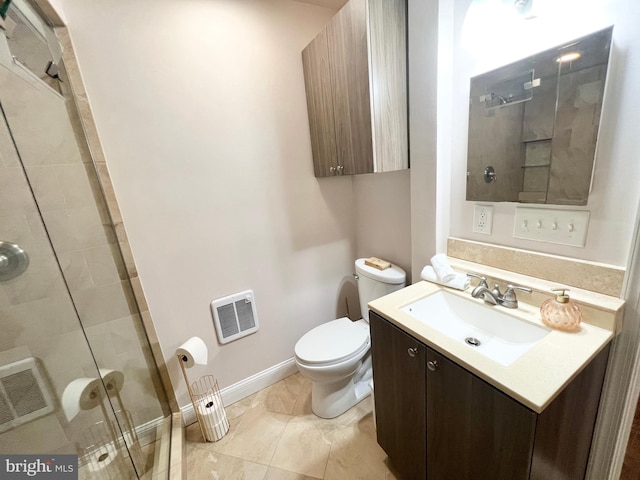 bathroom with vanity, a shower stall, toilet, and visible vents