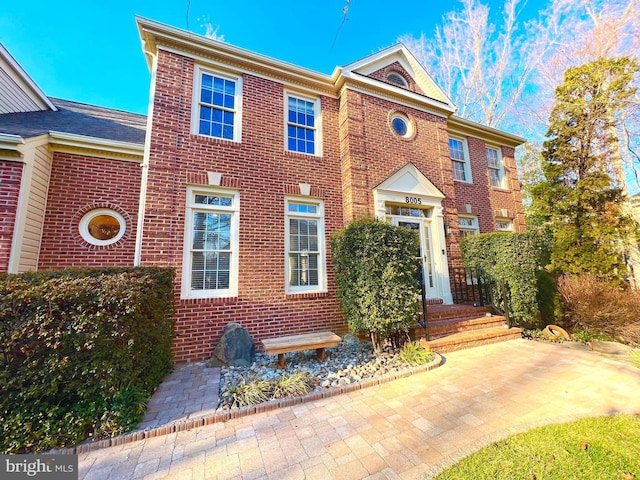 view of front of house with brick siding