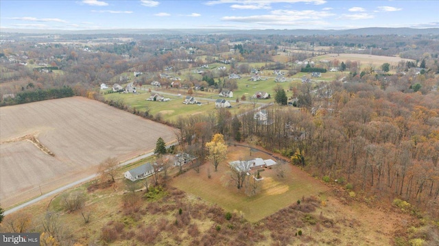 birds eye view of property with a rural view