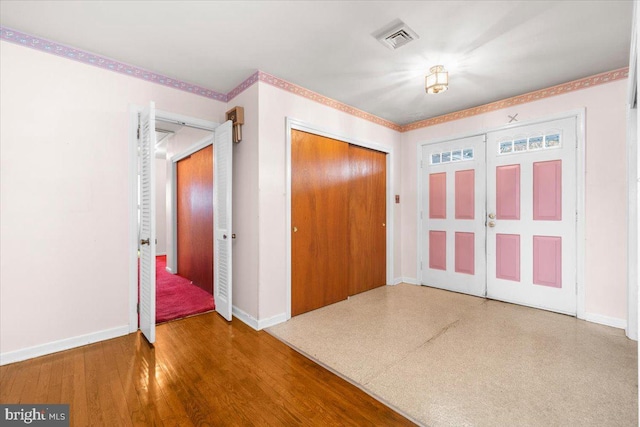 entryway featuring wood-type flooring