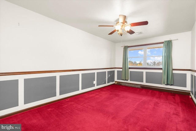 empty room with carpet floors and ceiling fan