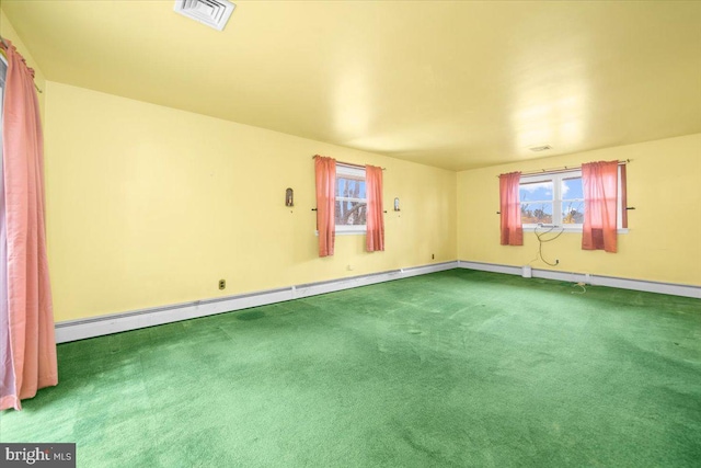 carpeted spare room featuring a baseboard radiator