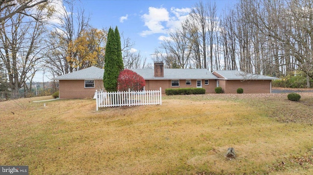 single story home with a front yard