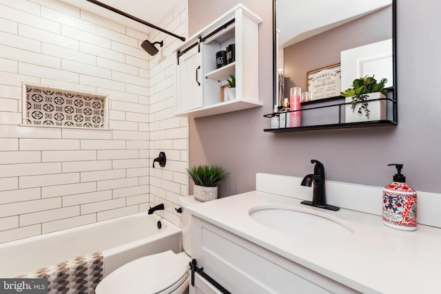 full bathroom with vanity, toilet, and tiled shower / bath