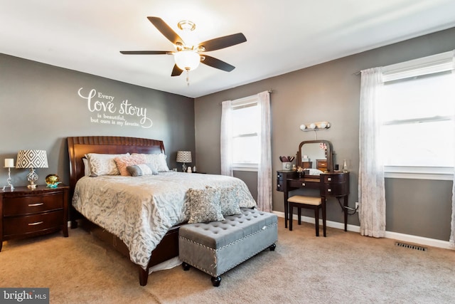 bedroom featuring light carpet and ceiling fan