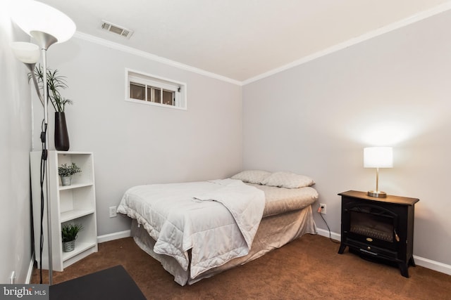 carpeted bedroom featuring a wood stove and ornamental molding