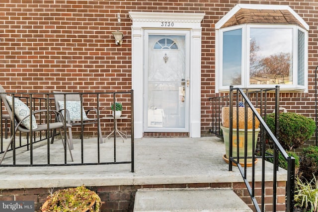 view of exterior entry featuring a porch