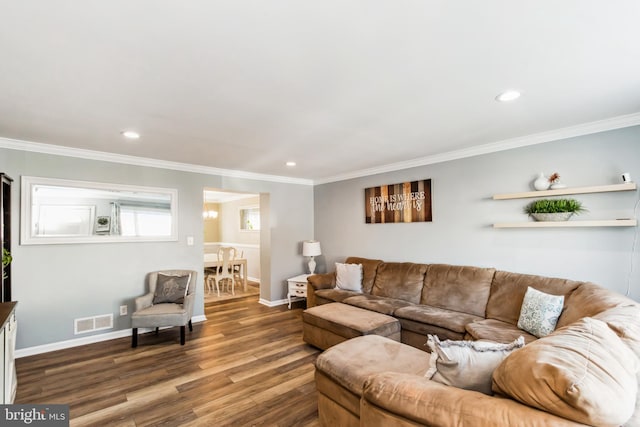 living room featuring ornamental molding and dark wood-type flooring