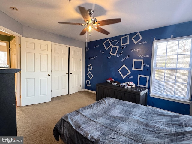 carpeted bedroom with ceiling fan