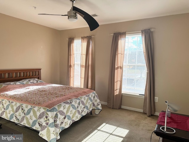 bedroom featuring ceiling fan and light colored carpet