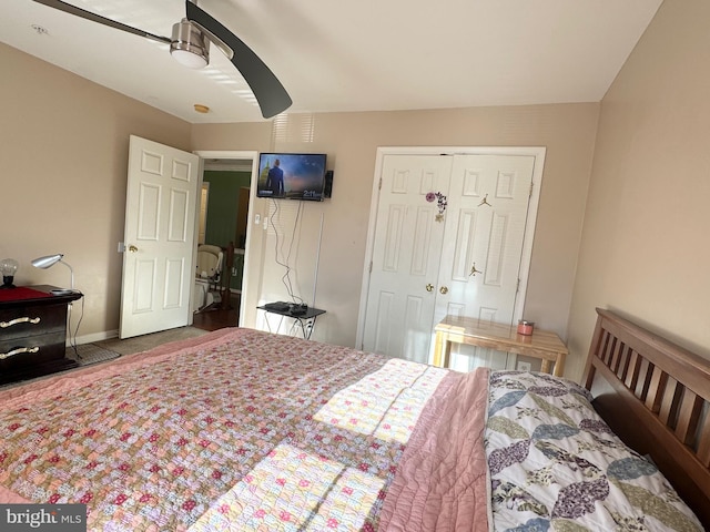 bedroom featuring ceiling fan and a closet