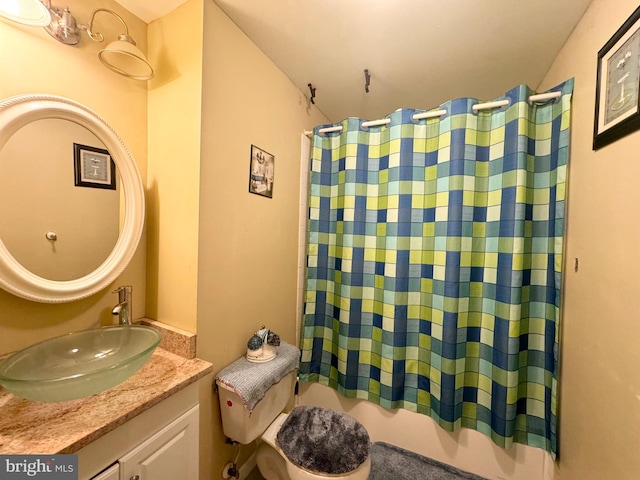 bathroom with shower / bath combo with shower curtain and vanity