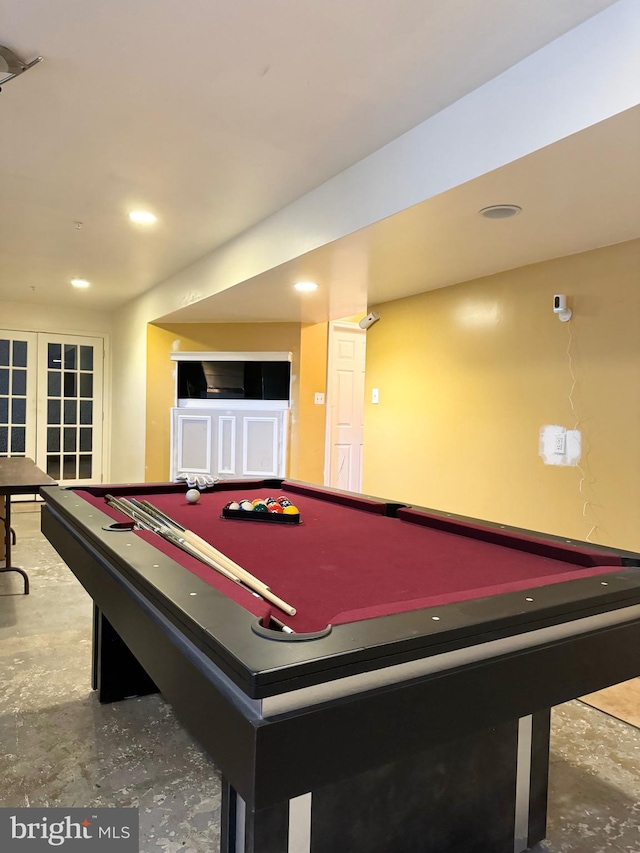 rec room featuring french doors, concrete floors, and pool table