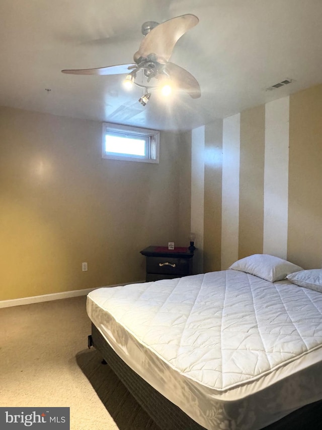 carpeted bedroom featuring ceiling fan