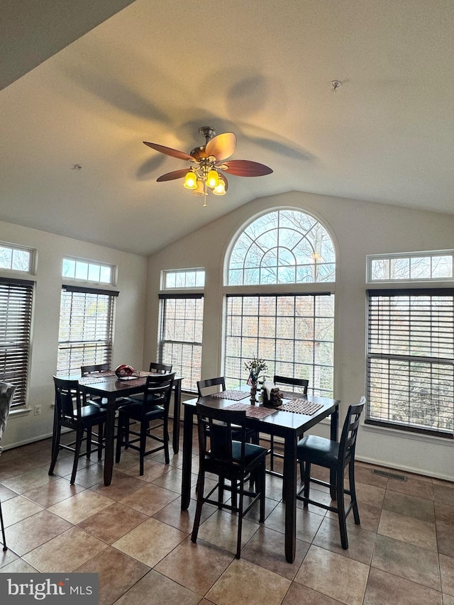 dining area featuring vaulted ceiling and ceiling fan