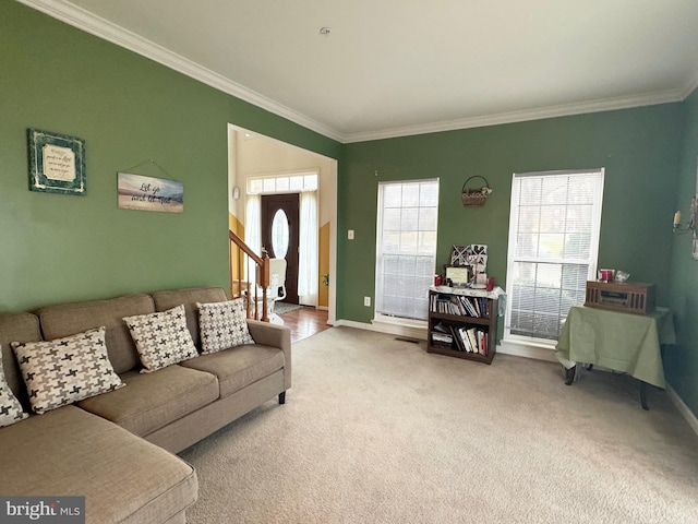 carpeted living room with ornamental molding