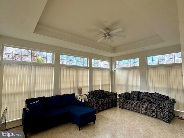 sunroom / solarium with a healthy amount of sunlight and a raised ceiling