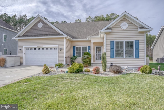 view of front of home with a garage, central air condition unit, and a front yard