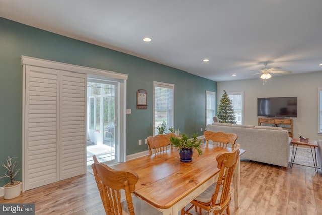 dining space featuring ceiling fan and light hardwood / wood-style floors