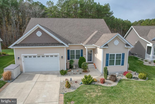 view of front of house featuring a front yard and a garage