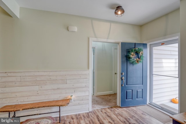 foyer entrance with light hardwood / wood-style floors