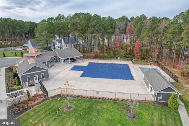 view of pool featuring a yard