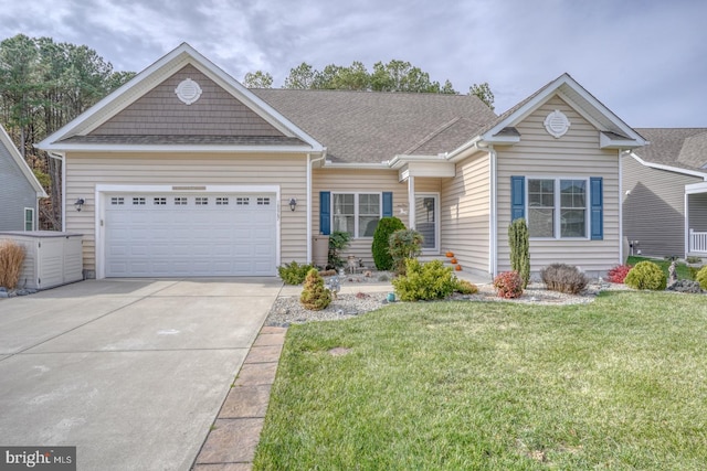 view of front of property with a garage and a front yard