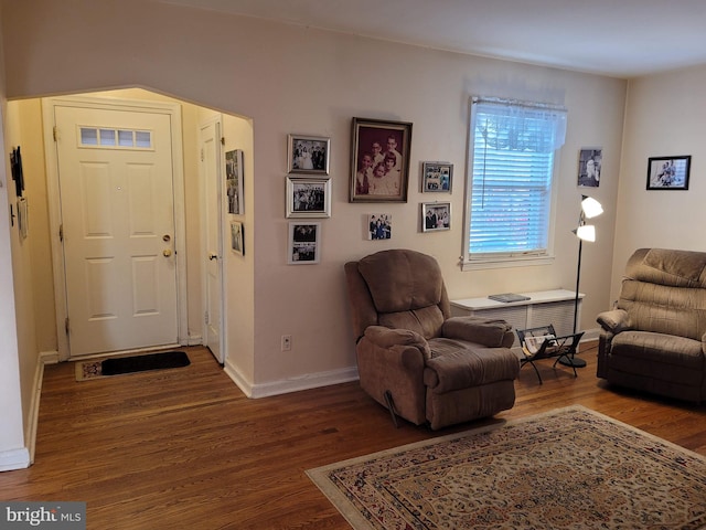 living area with hardwood / wood-style flooring