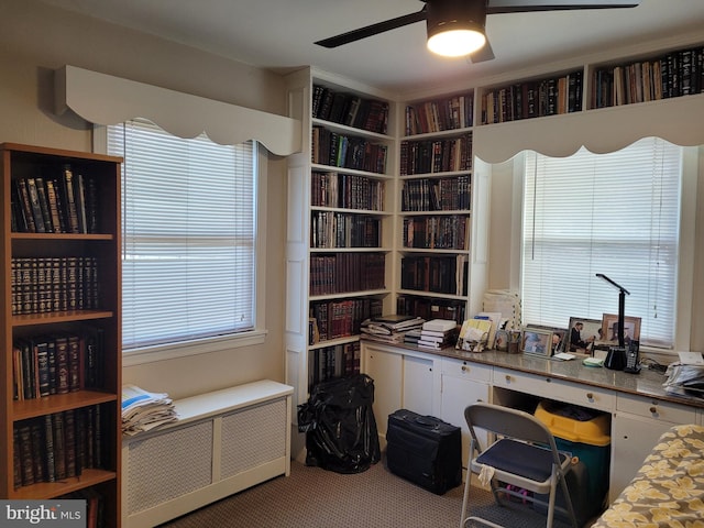 office area with ceiling fan, carpet floors, and a wealth of natural light