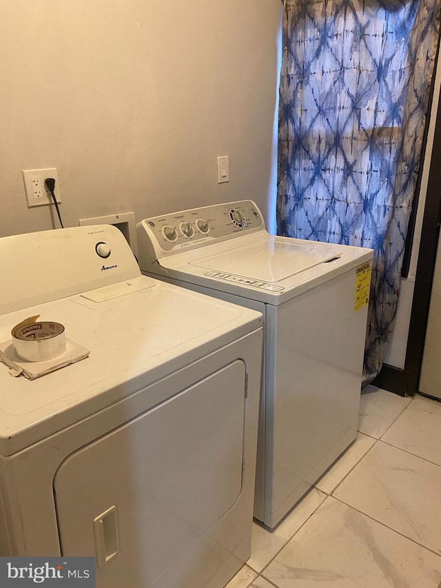 laundry area featuring independent washer and dryer