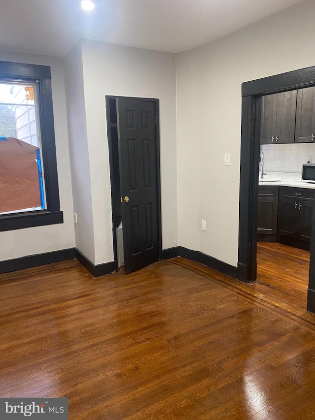 interior space with sink and dark hardwood / wood-style floors