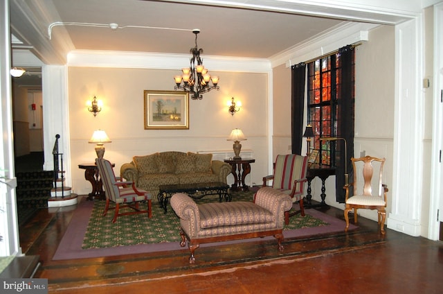 living room with a chandelier and ornamental molding