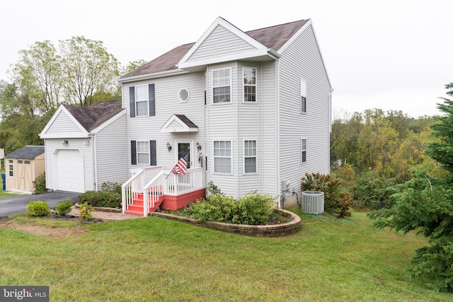 view of front facade featuring central AC unit and a front yard